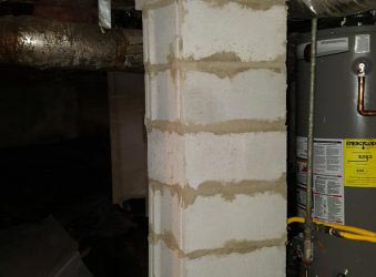 Cement piers installed inside a residential crawl space