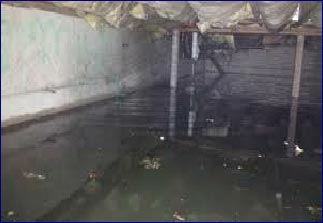 A crawl space with a lot of standing water